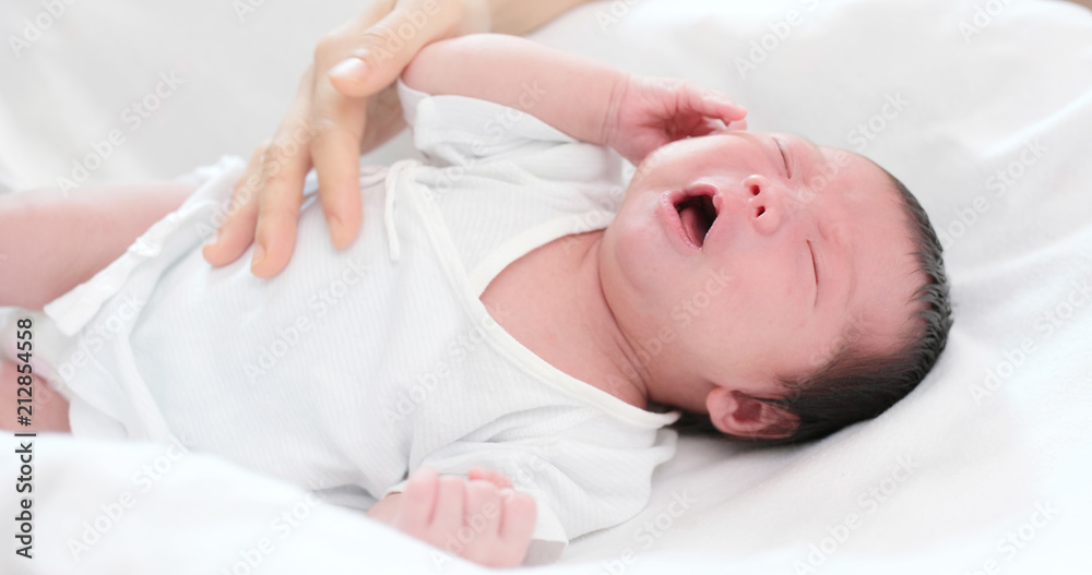 Baby new born baby crying with mother comforting Baby new born baby crying with mother comforting