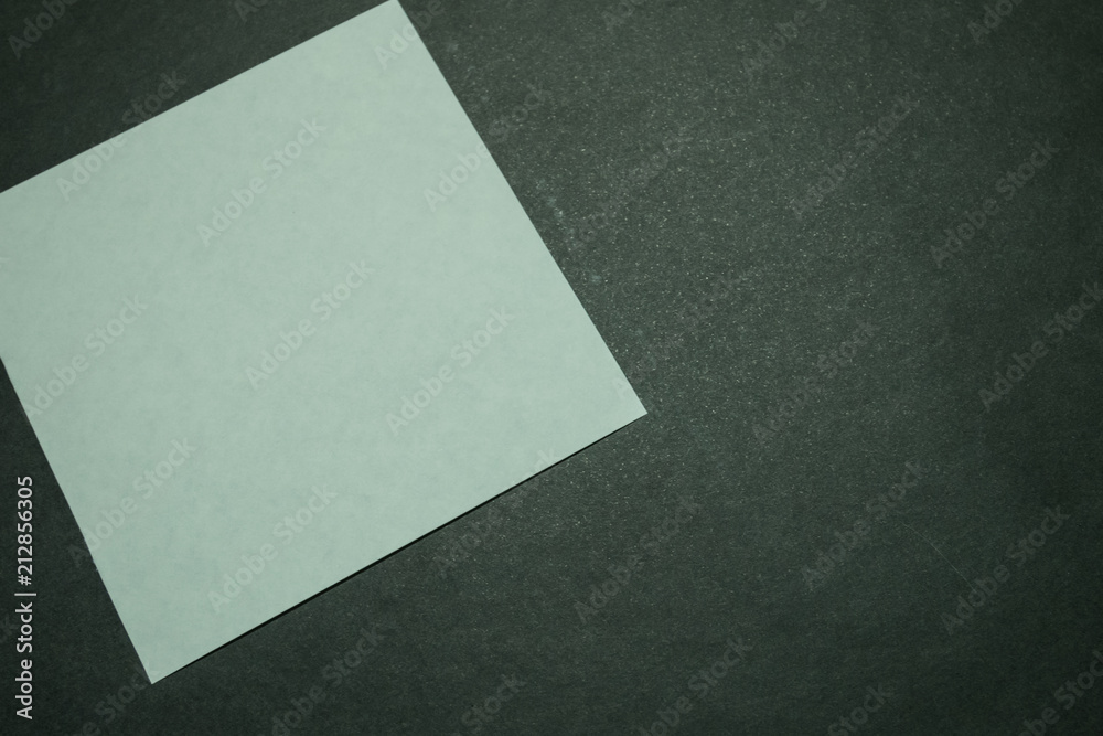 Blank paper on dark background. Blank paper on dark background.