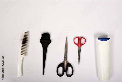Professional hairdressing tools and accessories on white background
