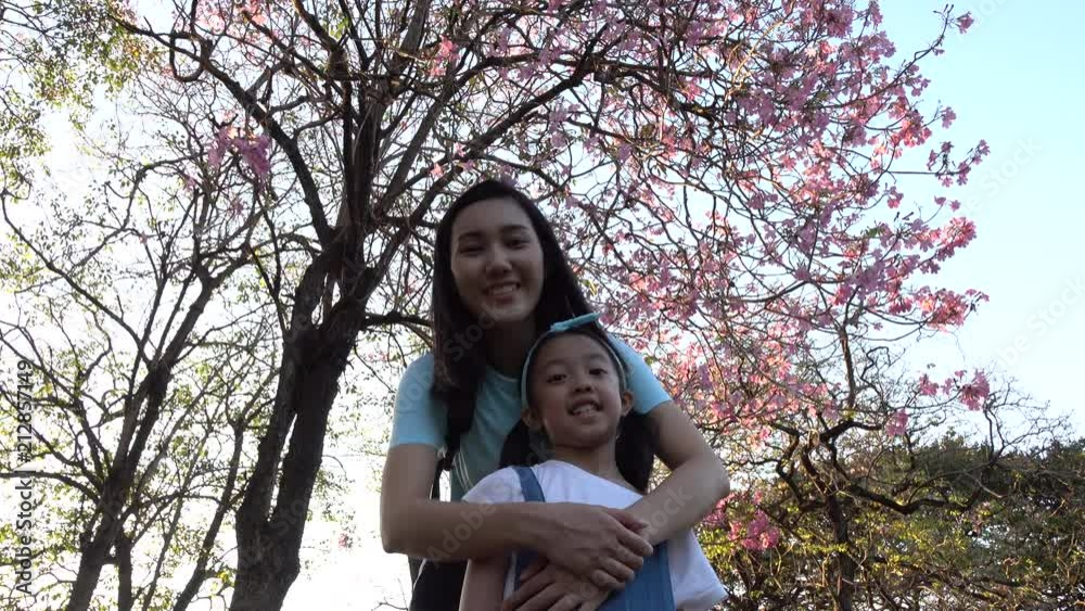 Happy little girl and mother in the public park Happy little girl and mother in the public park