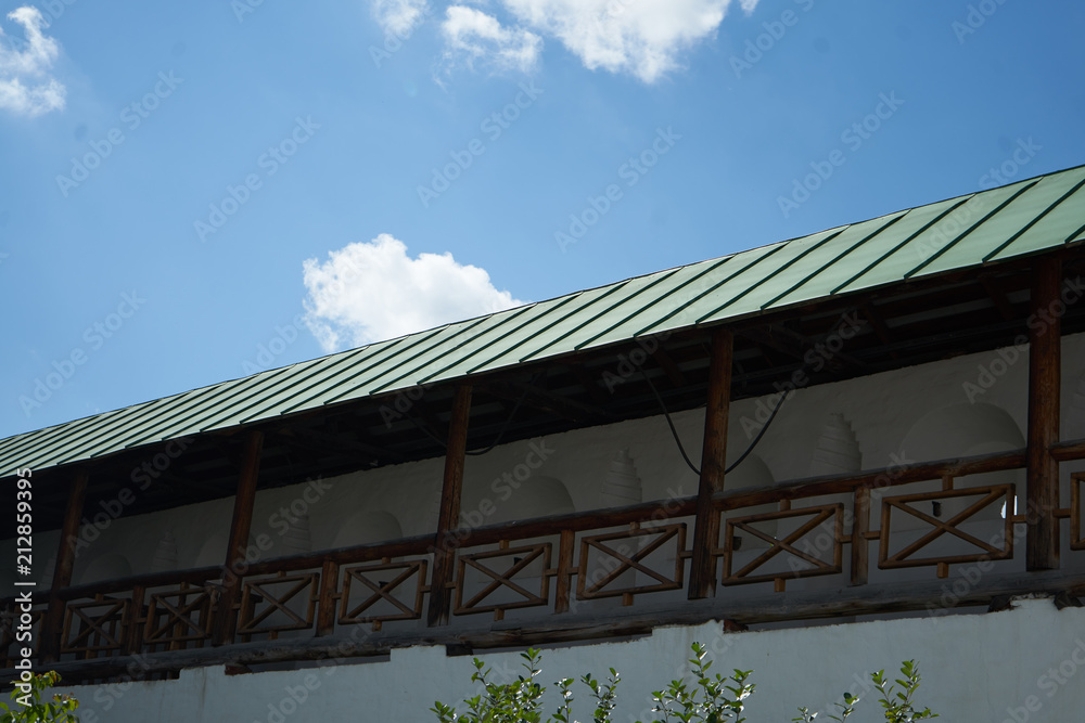 green roof on blue sky background green roof on blue sky background