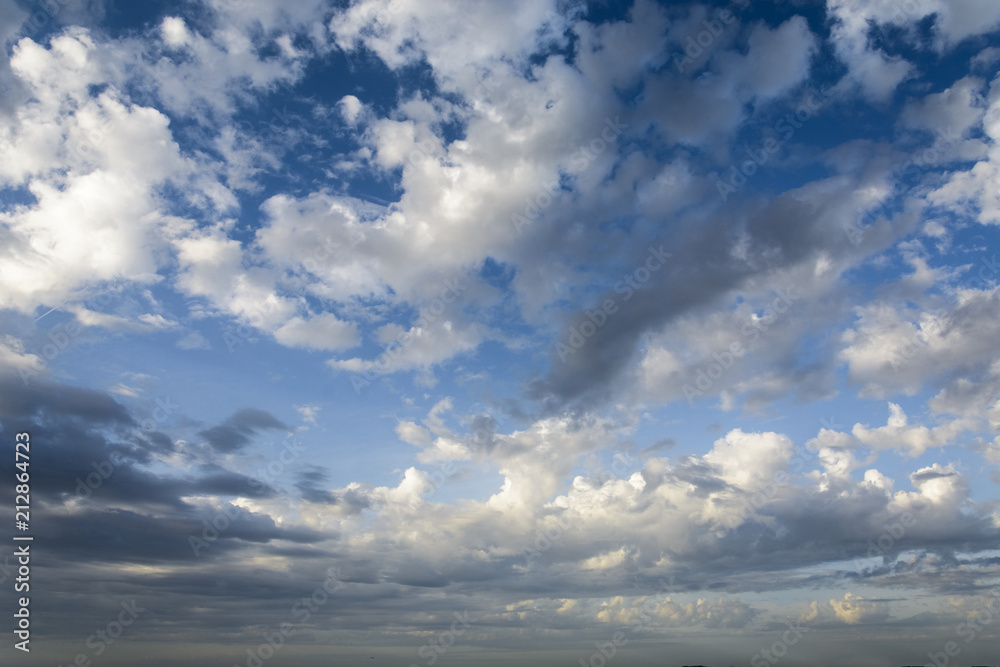 Blue sky with clouds in summer time.