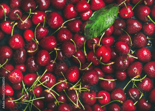 Fresh sweet cherry texture, wallpaper and background. Flat-lay of wet sweet cherries, top view. Summer food or local market produce concept