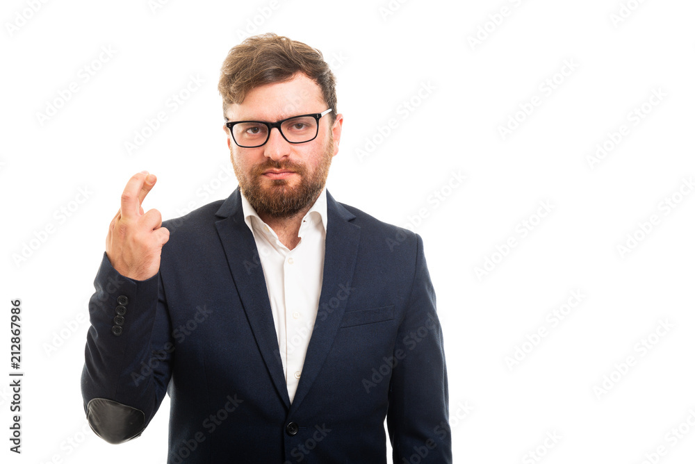 Portrait of business man showing cross fingers gesture. Portrait of business man showing cross fingers gesture.
