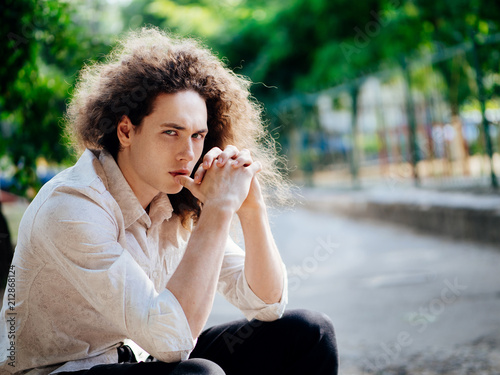 Young hipster man outdoors photo