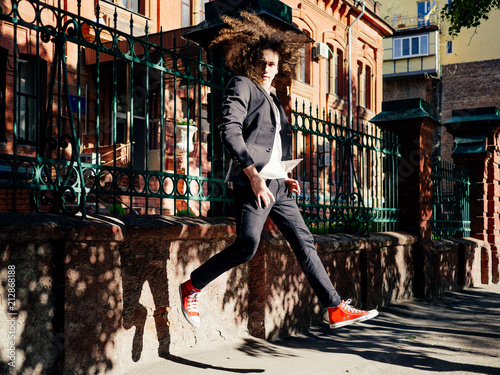 Young hipster man outdoors photo