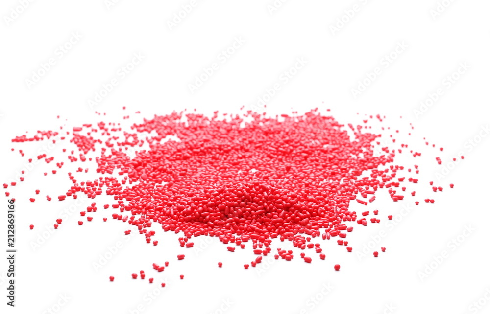 Red chocolate sprinkles, granules isolated on white background and texture, top view