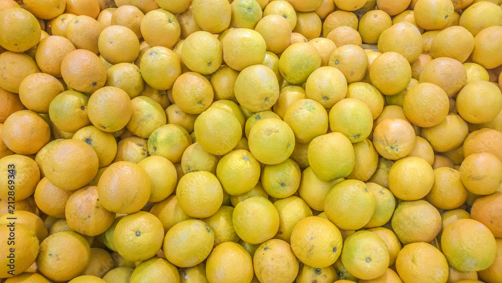 A bunch of orange-yellow oranges A bunch of orange-yellow oranges