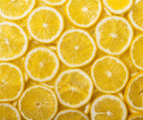 Background of many juicy lemon slices