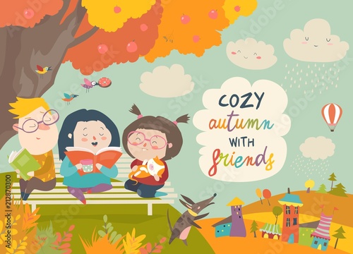 Happy children reading books in autumn park
