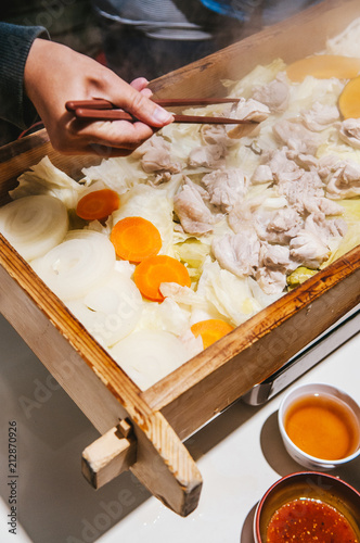 Famous steam chicken in wood box at Noboribetsu Date Jidaimura, Hokkaido, Japan. photo