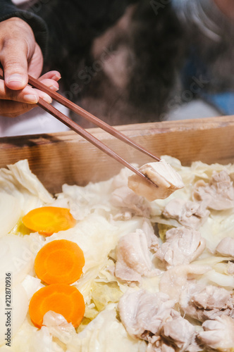 Famous steam chicken in wood box at Noboribetsu Date Jidaimura, Hokkaido, Japan. photo