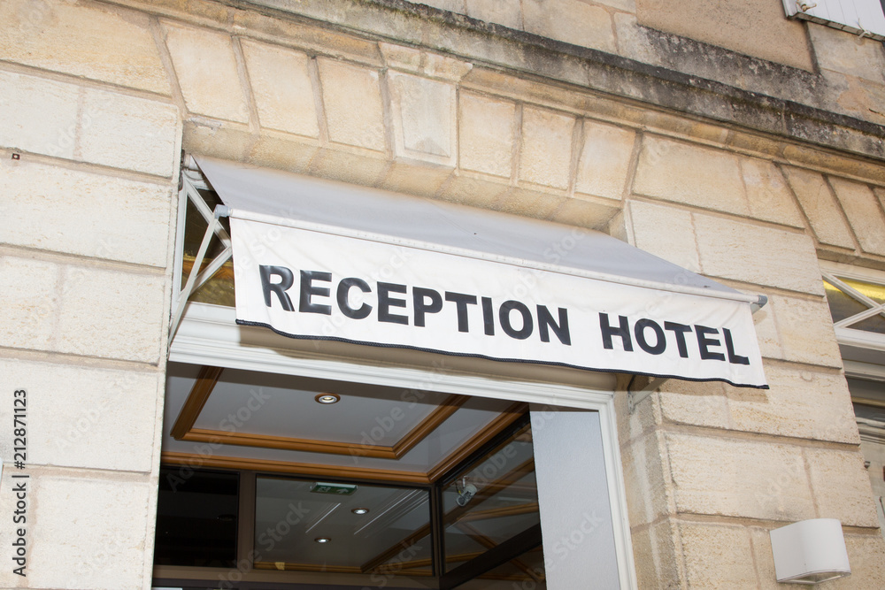 entrance of a hotel in a medieval city in France write reception hotel entrance of a hotel in a medieval city in France write reception hotel