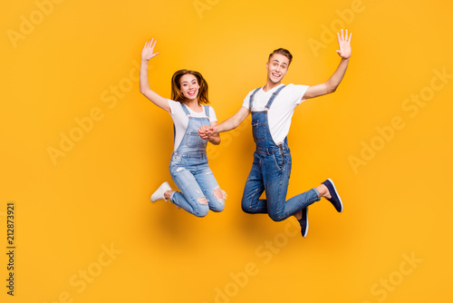 Canvas Print Full length portrait of beautiful attractive playful cheerful, comic couple wear