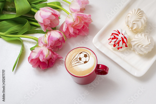 Coffee cappuccino in a cup for breakfast for a football fan photo