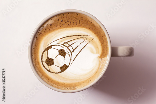 Coffee cappuccino in a cup for breakfast for a football fan