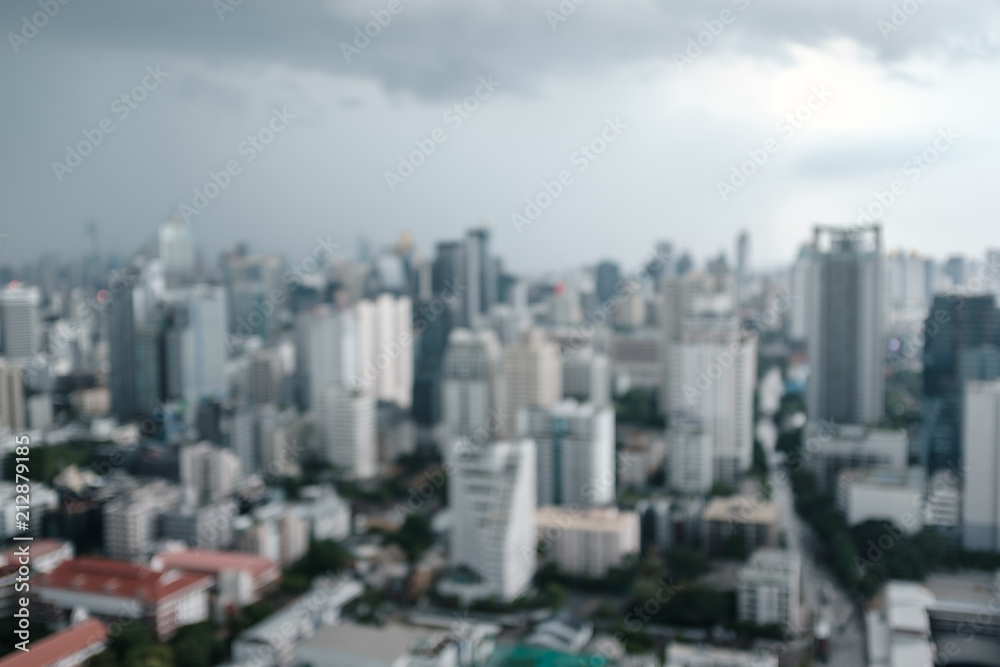 abstract blur and defocused rain clouds over city, aerial cityscape for background