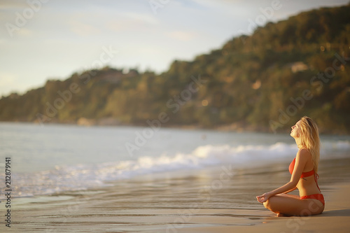 meditation and yoga on the beach / summer vacation concept health beauty, summer vacation yoga classes on the sea shore © kichigin19