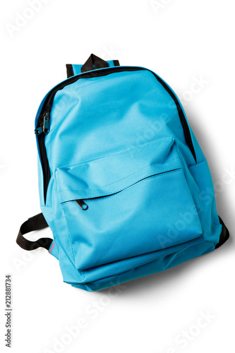 Top view of blue school backpack on white background.
