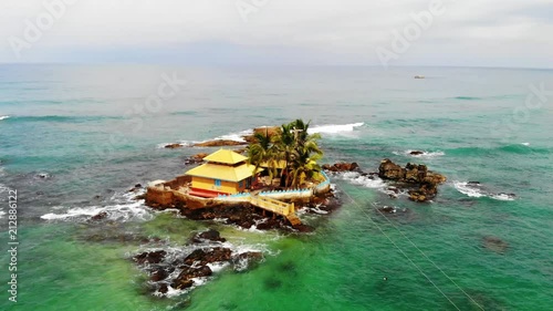 View of Indian Ocean and Seenigama Vihara Temple from Hikkaduwa, Sri Lanka. Sea background. Landscape. Seascape aerial view photo