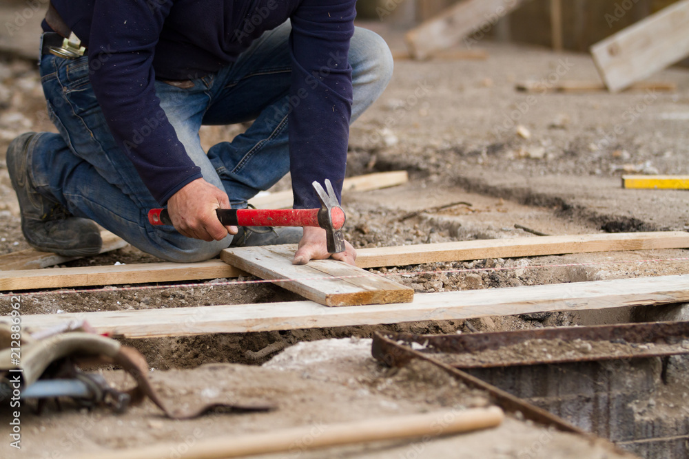 bricklayer at work in a building site