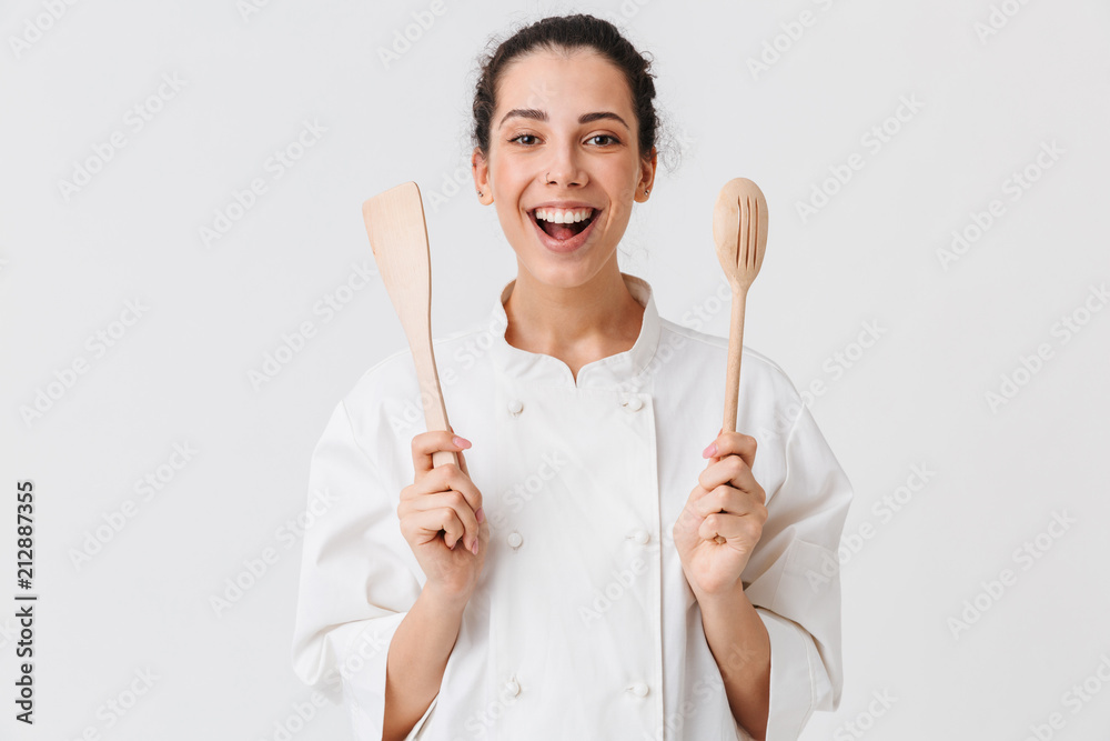 Portrait of a cheerful young woman cook - obrazy, fototapety, plakaty 