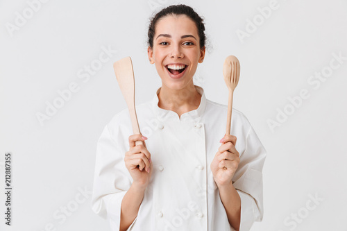 Portrait of a cheerful young woman cook photo