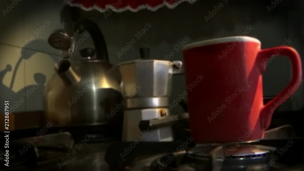 Kettle, italian coffee maker and a cup of black coffee. Kettle, italian coffee maker and a cup of black coffee.