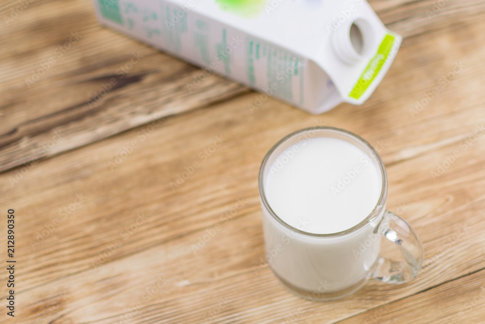 Glass kefir (milk) on a wooden background. The concept of diet, weight loss. Glass kefir (milk) on a wooden background. The concept of diet, weight loss.