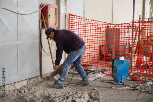 bricklayer at work in a building site