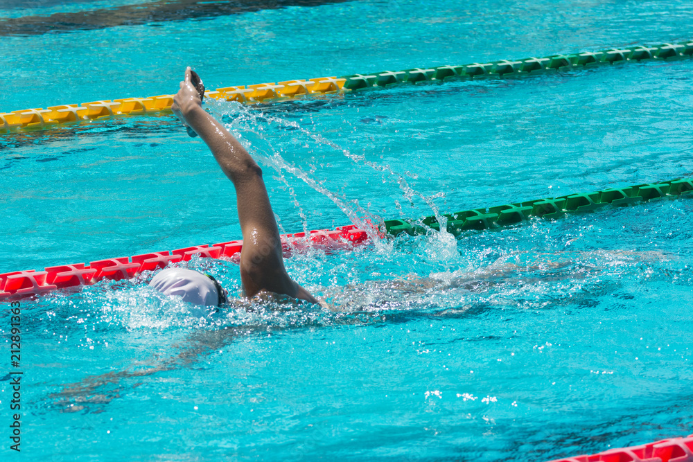 swimmer in lane pool, woman in water