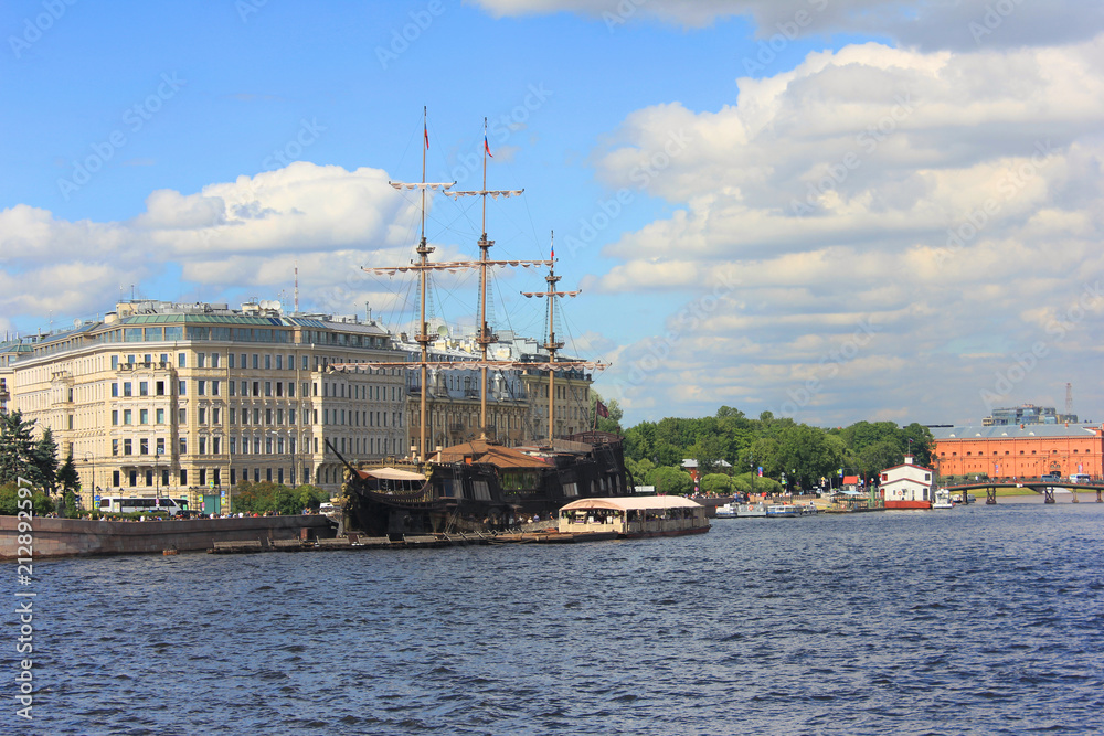 St. Petersburg Cityscape with Neva River Water and Old Historical Wooden Ship in Russia. Saint Petersburg City Landmarks on Summer Day, Colorful Skyline View of Downtown City Location. St. Petersburg Cityscape with Neva River Water and Old Historical Wooden Ship in Russia. Saint Petersburg City Landmarks on Summer Day, Colorful Skyline View of Downtown City Location.