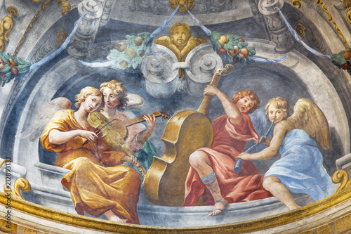 PARMA, ITALY - APRIL 15, 2018: The symbolic fresco of angels with the music instruments in church Chiesa di Santa Cristina by Filippo Maria Galletti (1636-1714).