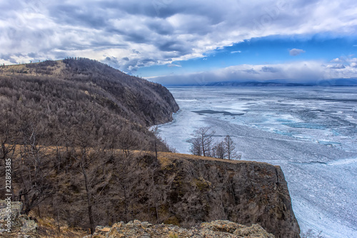 Ice on Lake Baikal  and cliffs of Cape Khoboy photo