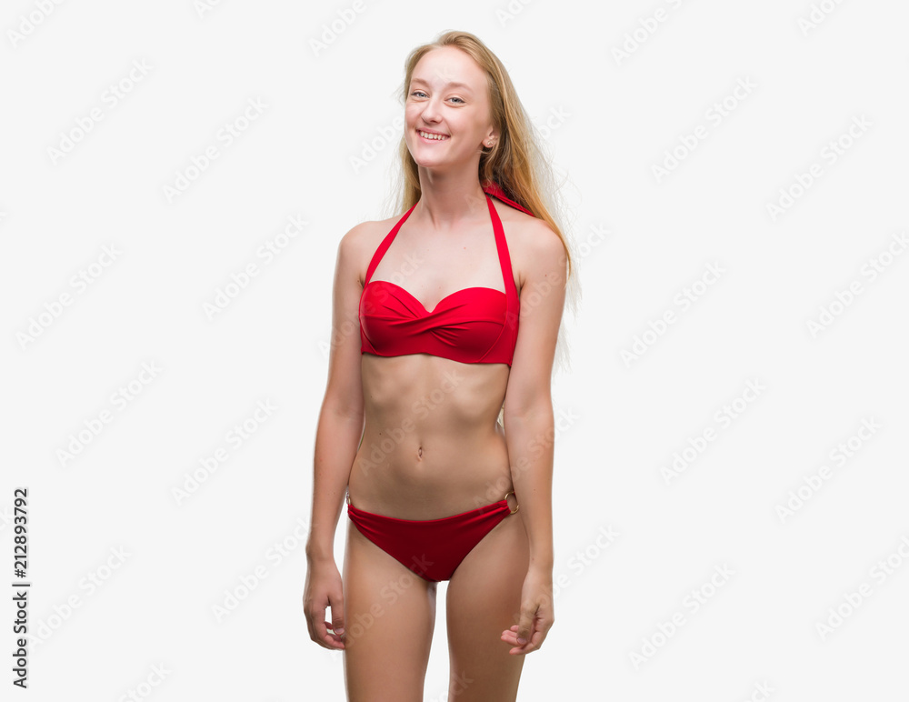 Young woman in red bikini on beach - Stock Image - F009/2861 - Science  Photo Library