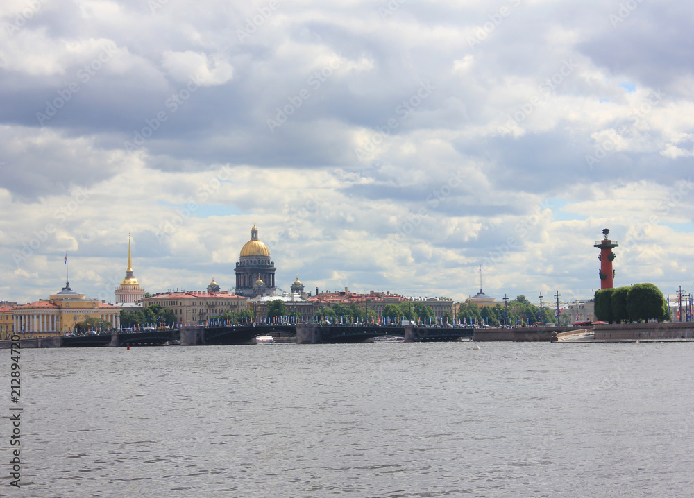 St. Petersburg Scenic Skyline with Neva River Water, Saint Isaac's Cathedral Dome, Rostral Columns and Palace Bridge in Russia. Summer Cityscape of Famous Russian City on Cloudy Day before Rain.