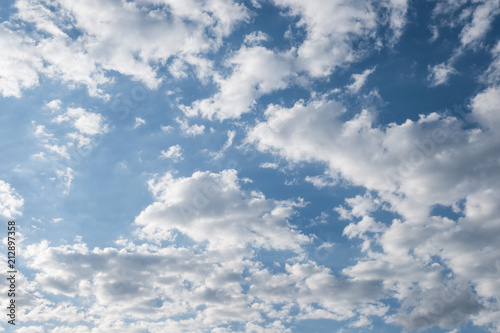 White clouds in summer blue sky photo