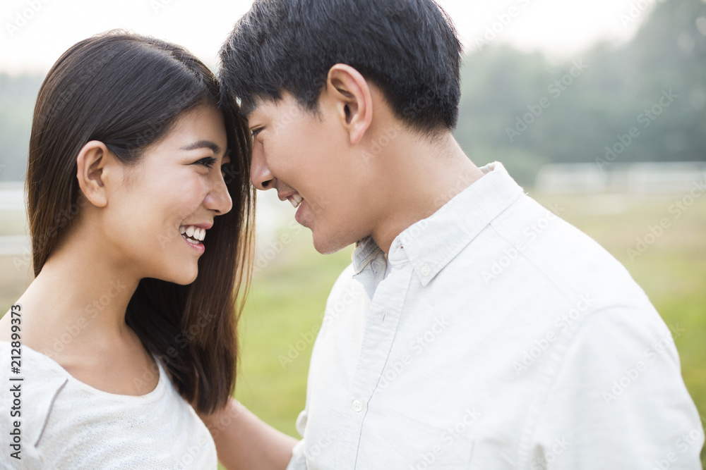 Close up of smiling young couple looking at each other Close up of smiling young couple looking at each other