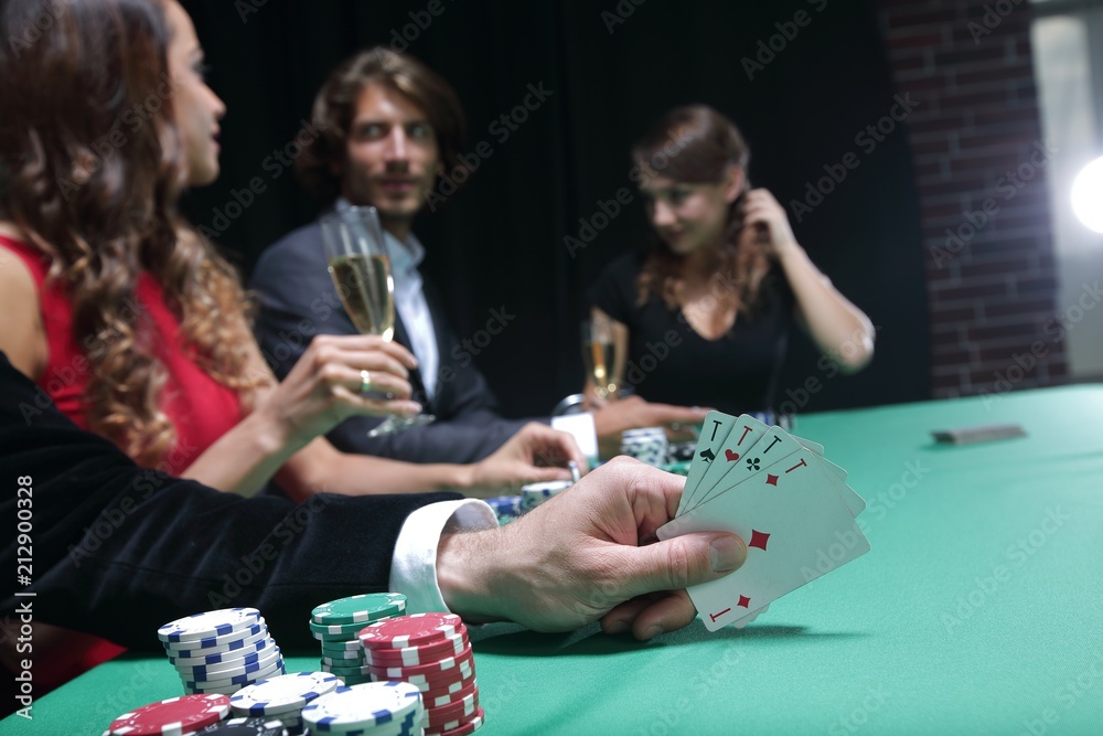 Closeup of poker hand of aces in pastel colors Closeup of poker hand of aces in pastel colors