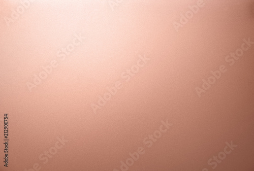 Copper texture. The smooth surface texture of metal sheet with white light glare.