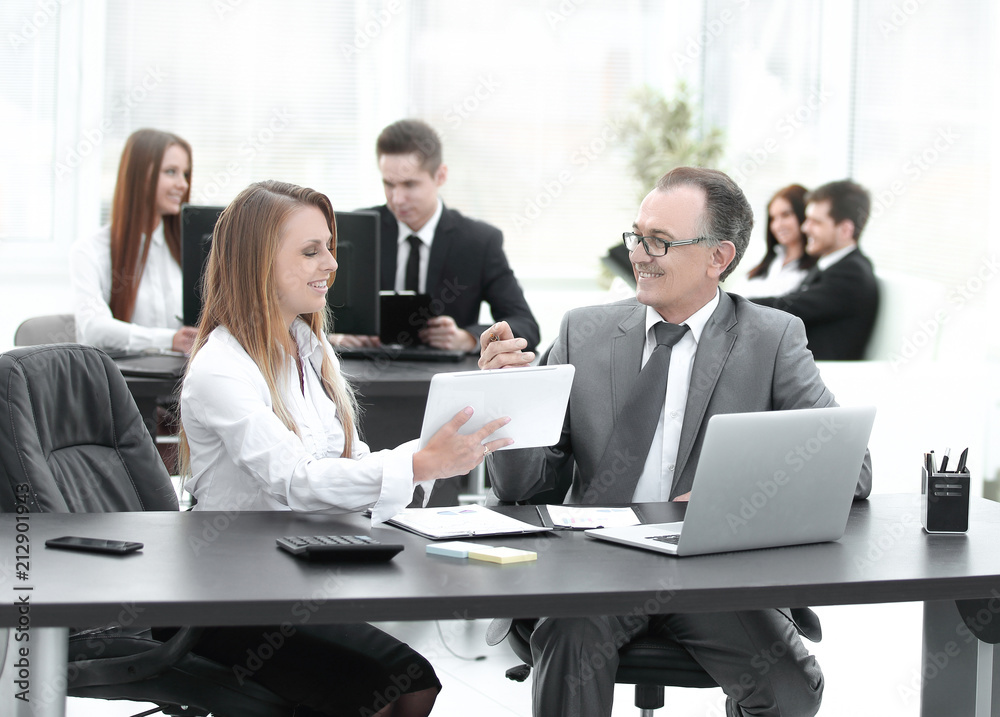 employees using digital tablet to work with financial data employees using digital tablet to work with financial data
