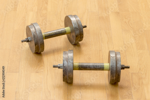 Two iron dumbbells on the floor. the concept of a healthy lifestyle and sport.