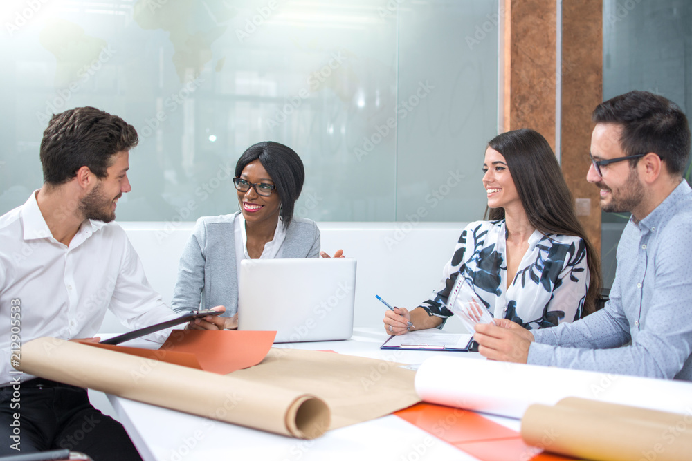 Businesspeople discussing together in conference room during meeting at office Businesspeople discussing together in conference room during meeting at office
