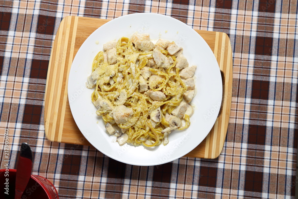 Macaroni of Carbonara with smoked sausage, bacon, sauce. Tasty lunch in the Italian restaurant with herbs, dill Macaroni of Carbonara with smoked sausage, bacon, sauce. Tasty lunch in the Italian restaurant with herbs, dill
