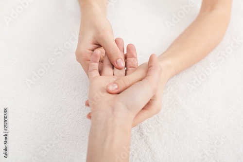 Hand massage closeup, acupressure photo