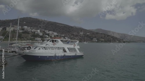 Panoramic view of the gulf of Elounda with Spinalonga island Crete, Cruise Greece Coast Inspirational Landscape, mirror on big boat photo