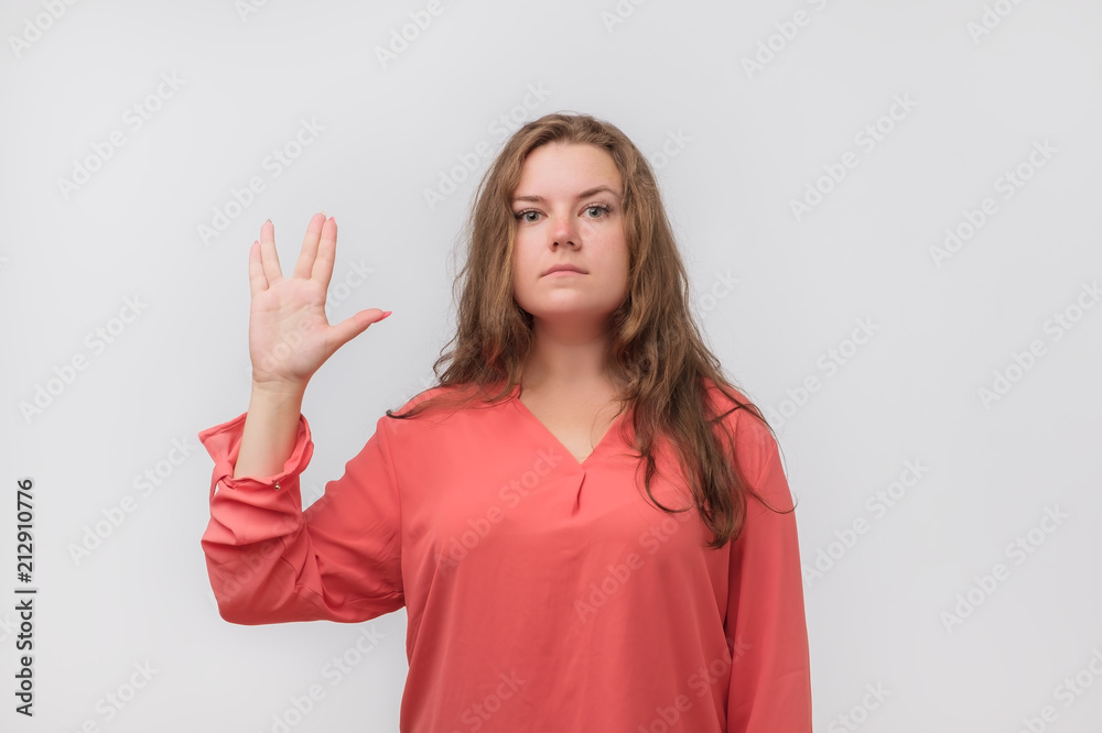 Pretty woman making Vulcan greeting. Concept of great film fan. Pretty woman making Vulcan greeting. Concept of great film fan.