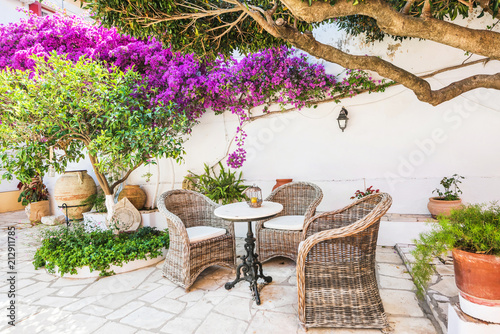 Fototapeta Naklejka Na Ścianę i Meble -  Cafe in Greece. Mediterranean style. Vacations summer relaxation concept