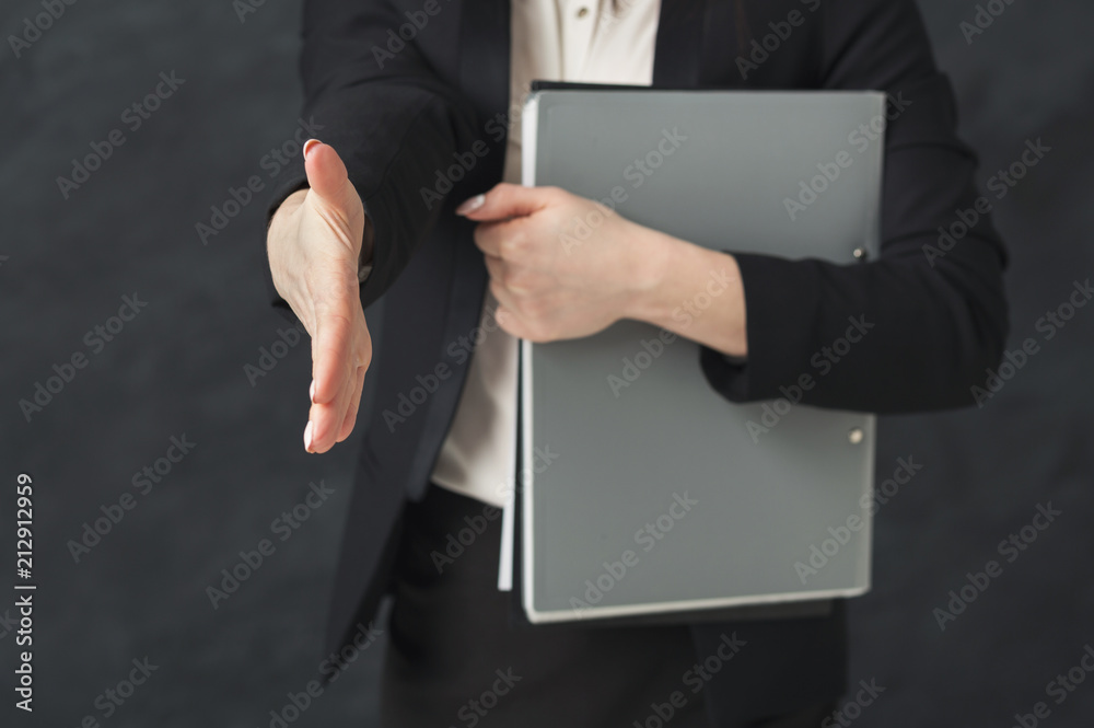 Business woman with notepad on black background Business woman with notepad on black background