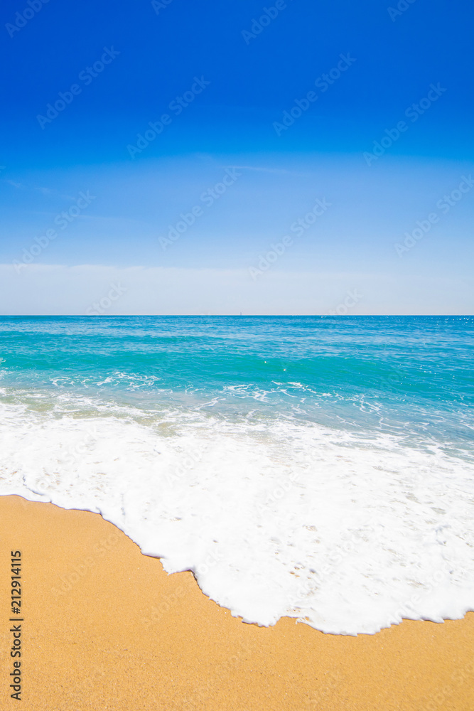 Beautiful Tropical  beach with Soft wave of blue ocean, sand and transparent sky. Summer travel holiday background concept. Sea panorama.